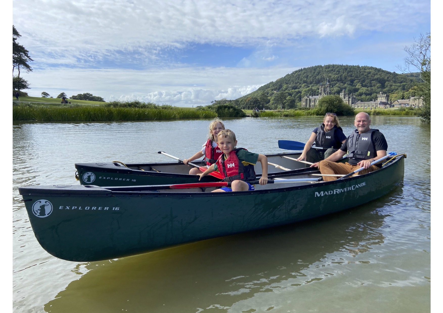 Family of four sat in two canoes